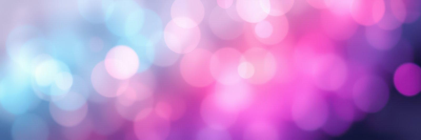 Colorful bokeh background featuring vibrant pink and blue lights in a soft, dreamy atmosphere